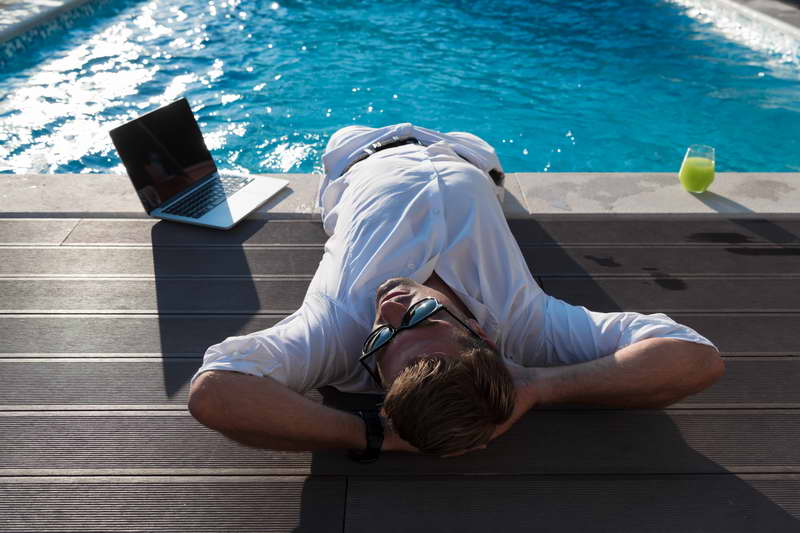 A modern senior man in casual clothes enjoys a vacation in an expensive house. Selective focus